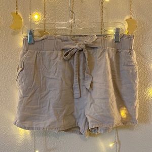 Light tan, light weight shorts with drawstring. Size large, but run pretty small